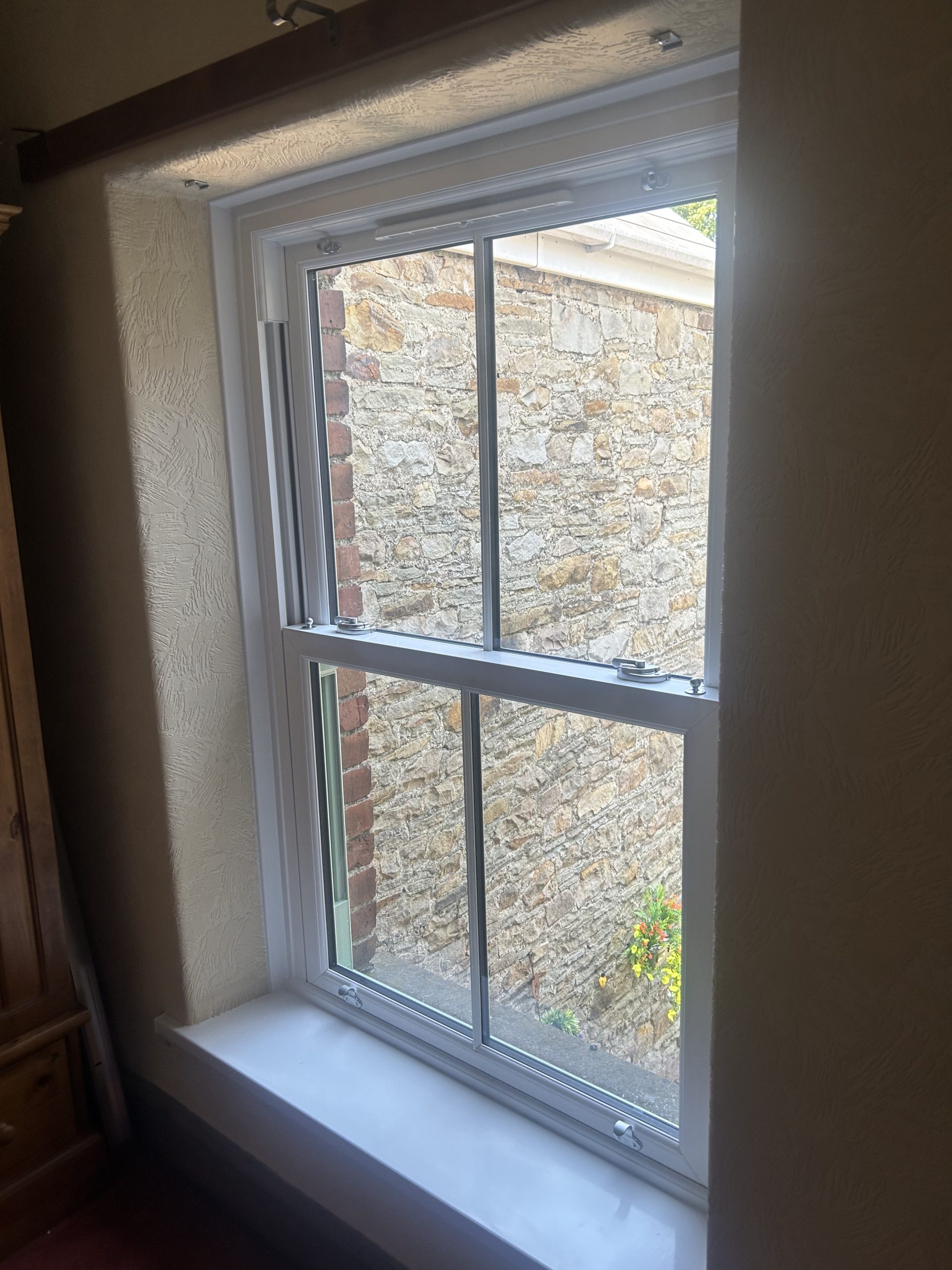 https://www.leekeswindows.co.uk/wp-content/uploads/2025/08/sliding-sash-windows-case-study-interior-scaled.jpeg